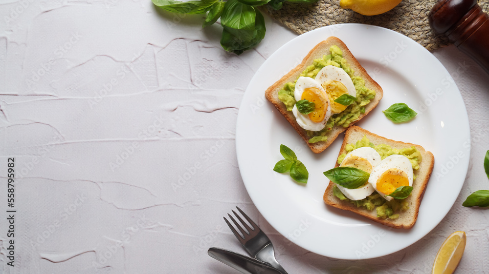 Tasty sandwiches with boiled egg, avocado and spinach served on white textured table, flat lay. Space for text