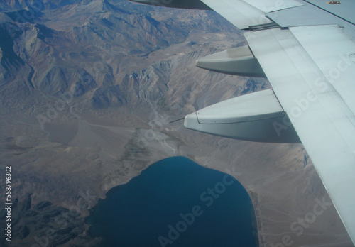 view of the mountains from the window of a plane