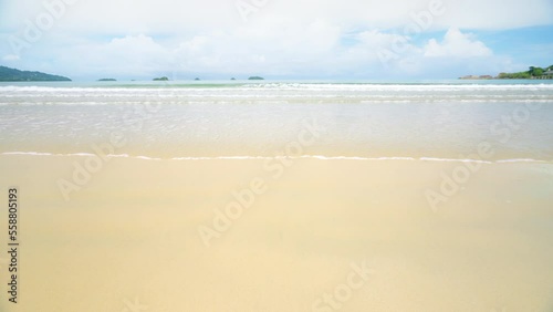 Landscapes view beach sand with blue sky in summer day. Travel to relax  with natural sea and ocean in holiday. Empty beach copy space or frame work of water and sand for background. slow motion.