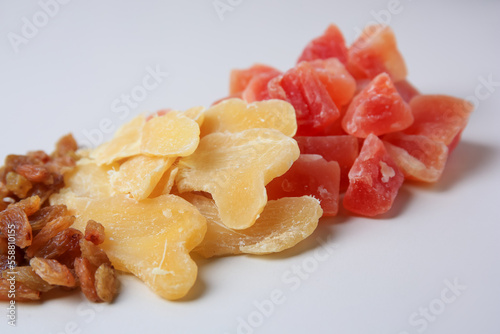 Pile of different dried fruits on white background  closeup