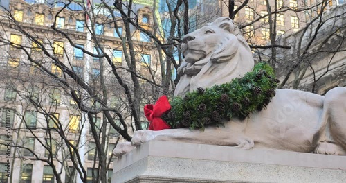 Great Lion Statue Adorned With Christmas Wreath At New York Public Library In Midtown Manhattan, New York, USA. Low Angle photo