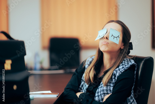 Tired and Bored Office Worker Feeling Sleepy and Silly. Funny businesswoman being bored playing with sticky notes
