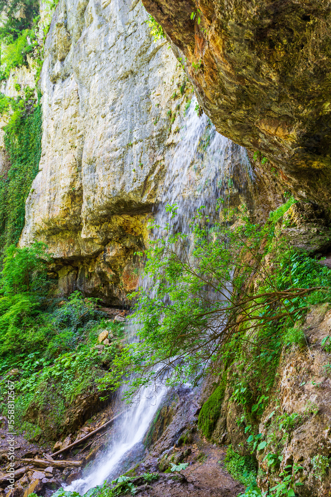 waterfall, cascade of a mountain river in a stone bed, summer season,panoramic view. waterfall, cascade of a mountain river in a stone bed, summer season,panoramic view.