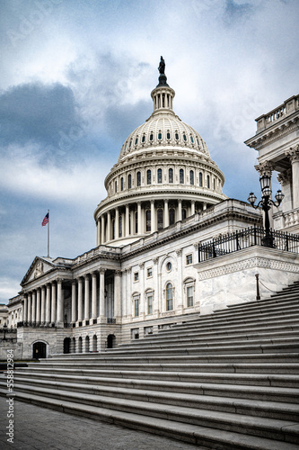 Fototapeta Naklejka Na Ścianę i Meble -  Facade of the United States Capitol building in Washington, D.C. on a cloudy moody day.