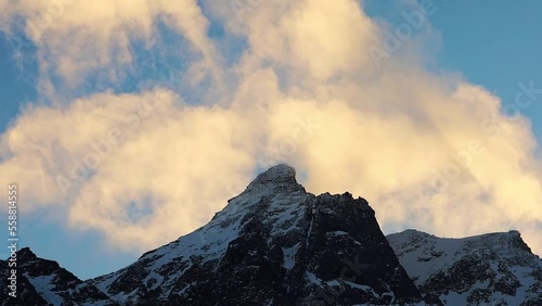 Wintertime in Norwegian mountains. Fast flowing clouds over the high peaks, photo