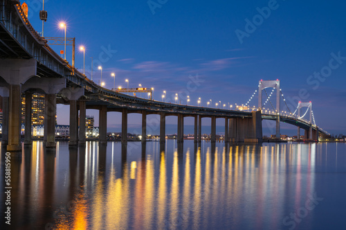 A nightscape photo of New York City Throgs Neck Bridge from Queens to the Bronx 