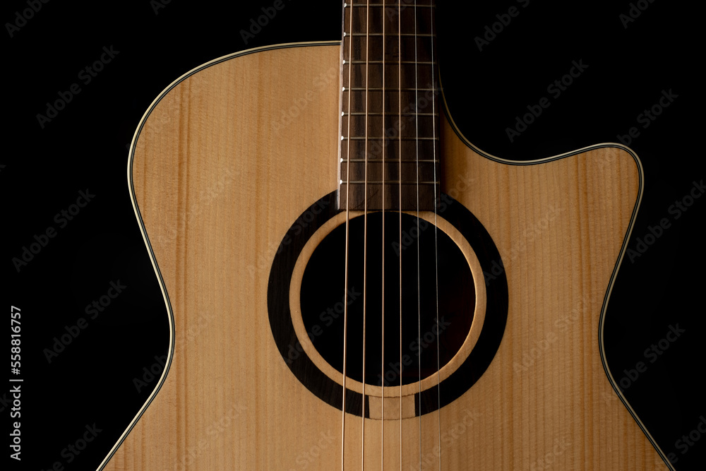 Classic Acoustic GA guitar with Satin Finished close up, dramatically lit on a black background with copy space
