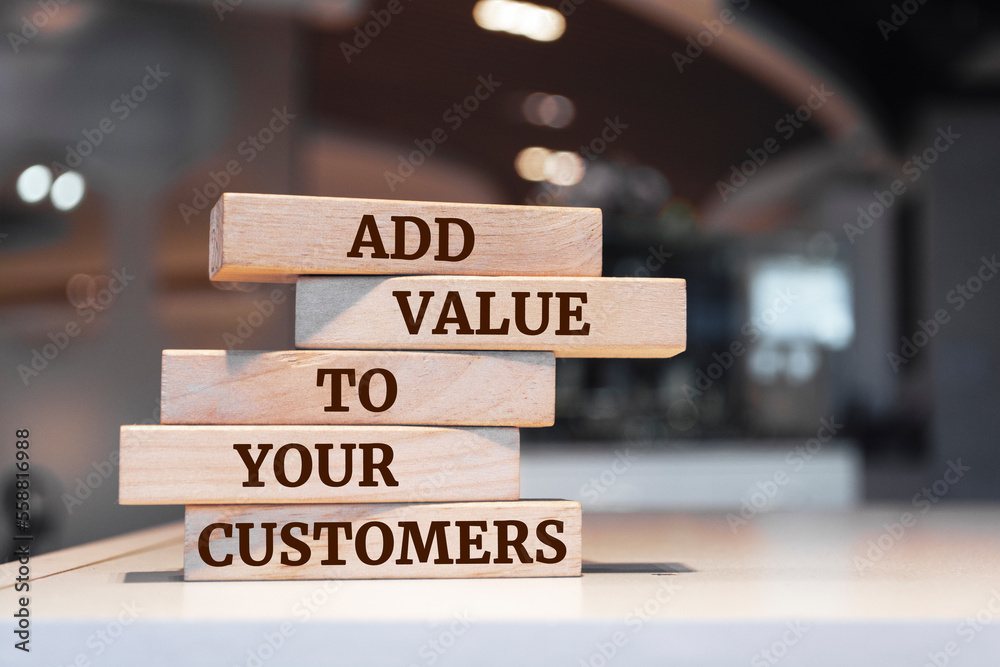 Wooden blocks with words 'ADD VALUE TO YOUR CUSTOMERS'.