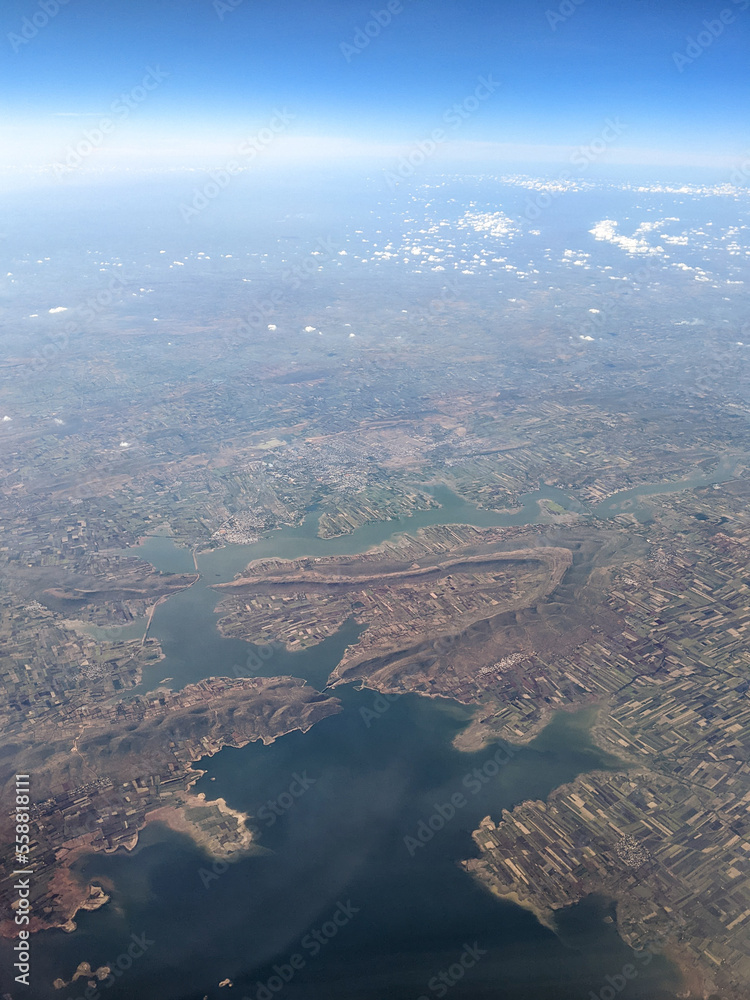 India, Bangalore to Mumbai, a view of a large body of water with a mountain in the background India, Bangalore to Mumbai, a view of a large body of water with a mountain in the background