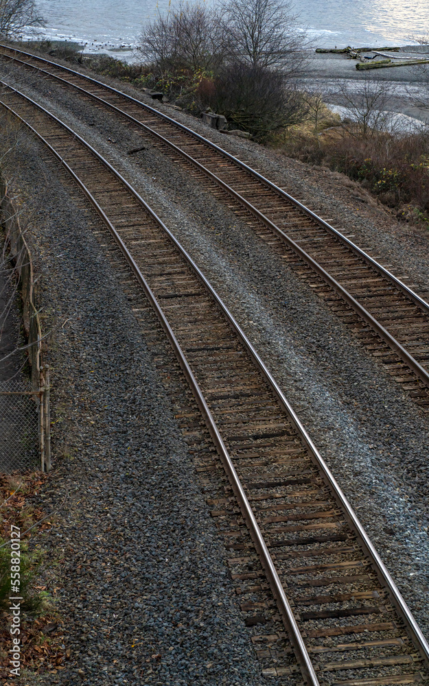 Fototapeta premium Two sets of railraod tracks curving left