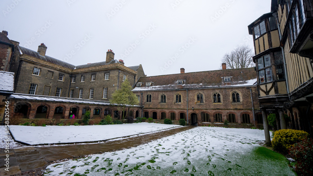 Queens' College Cambridge with Library Old Hall Cloister Court at Cambridge University during winter snow at Cambridge , United Kingdom : 3 March 2018