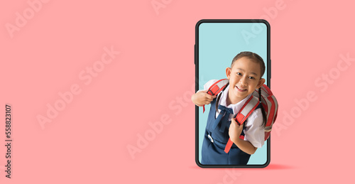 Happy asian school girl in uniform with big smart phone frame