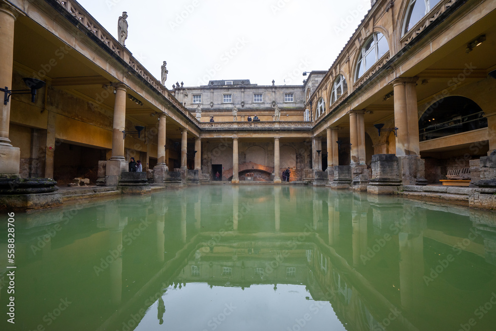 The Roman Bath ,  well preserved Roman thermae in old town of Bath during winter cloudy day in Bath , United Kingdom : 5 March 2018