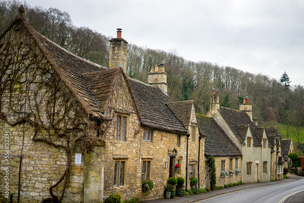 Castle Combe , Beautiful village in Cotwolds with old stone houses bridge and river during winter in Wiltshire , United Kingdom : 6 March 2018 Castle Combe , Beautiful village in Cotwolds with old stone houses bridge and river during winter in Wiltshire , United Kingdom : 6 March 2018