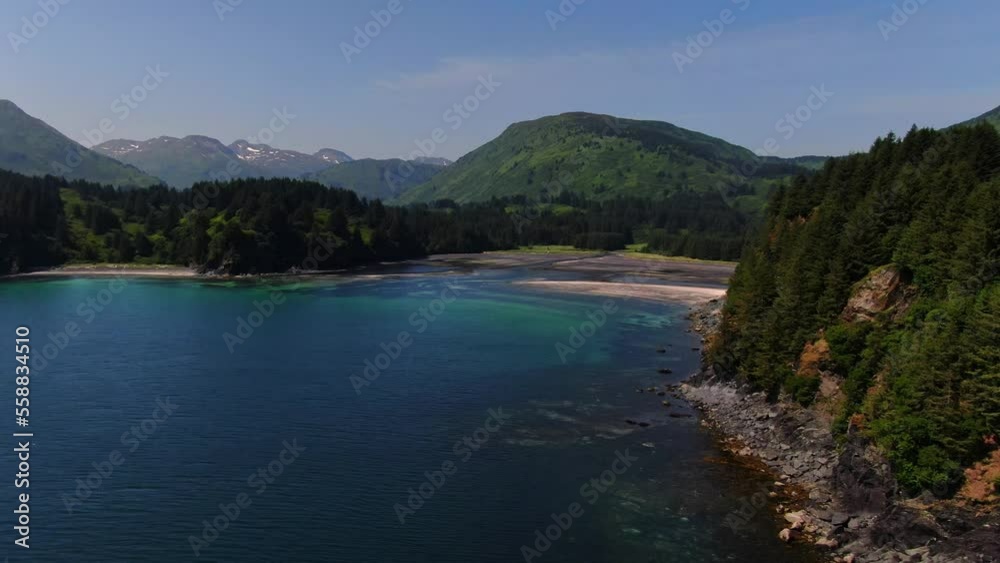 Azure Sea Waters And Vegetated Coastline Of Kodiak In Alaska, USA. wide aerial Azure Sea Waters And Vegetated Coastline Of Kodiak In Alaska, USA. wide aerial