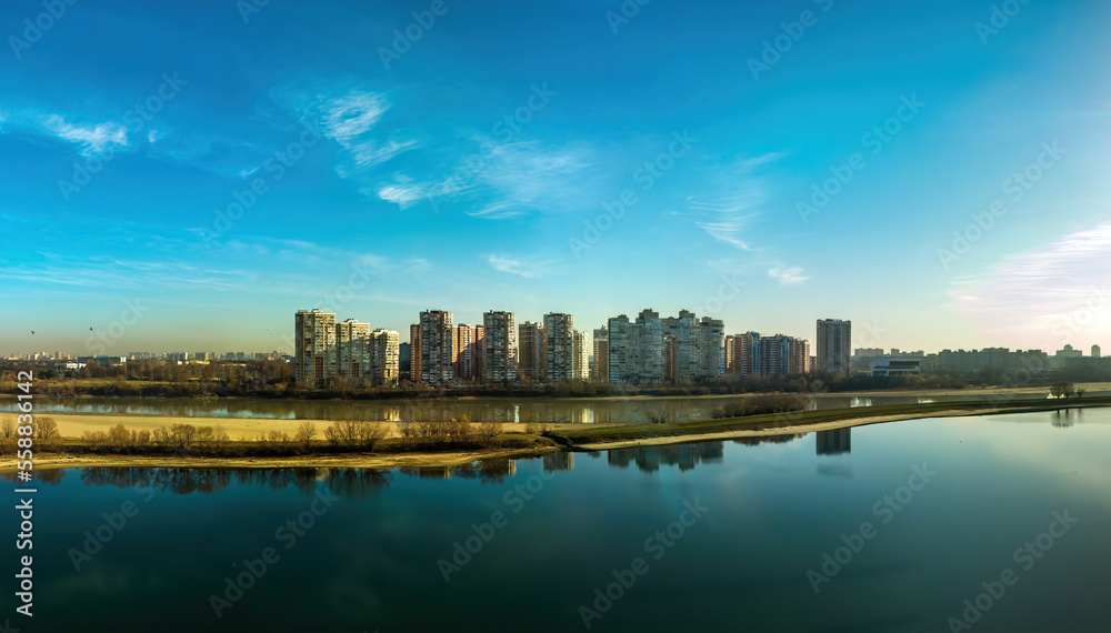 aerial landscape of high-rise buildings on the outskirts of the city of Krasnodar near the lake in the valley of the Kuban river on a sunny winter day