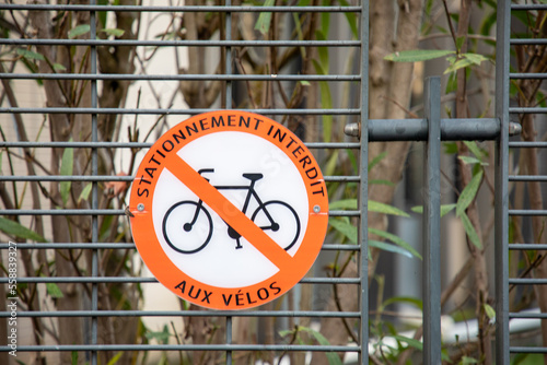 stationnement interdit aux velos french text sign means parking prohibited for bicycle prohibited traffic sign No bike no parking wall panel in city photo