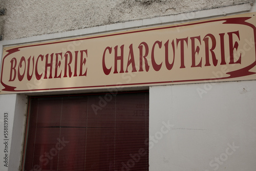 boucherie charcuterie old vintage text on retro facade of means french butcher delicatessen shop in france city © OceanProd