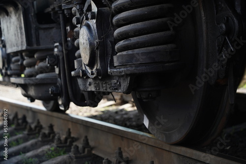 Almaty, Kazakhstan - 05.20.2022 - The wheels of the passenger train on the rails at the terminal station.