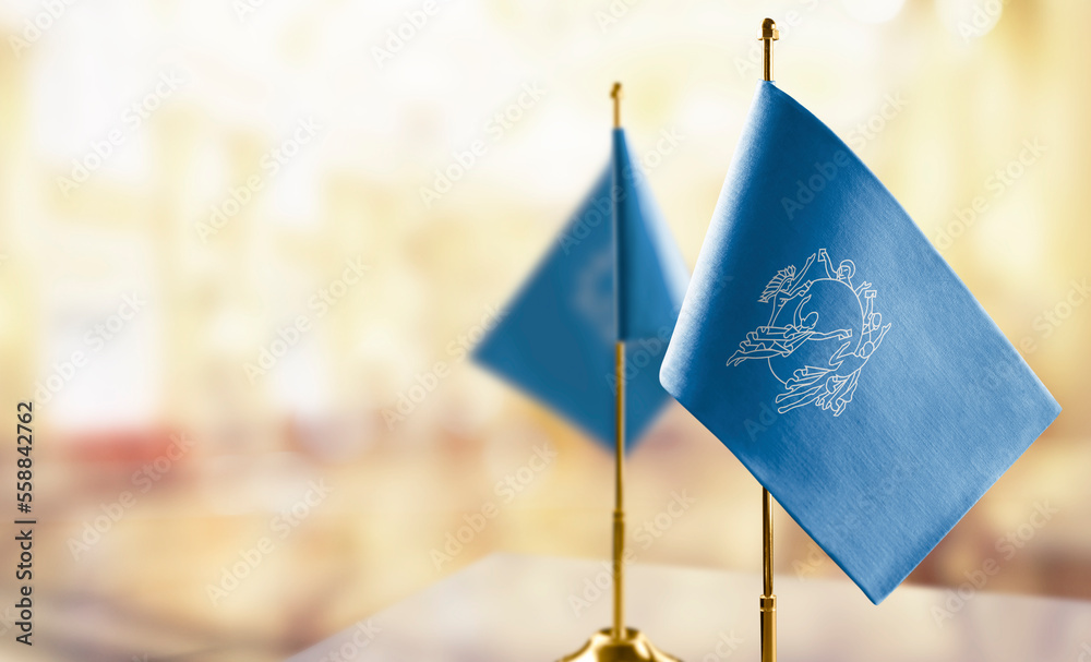 Small flags of the Semeral Postal Union on an abstract blurry background