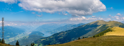 Panoramic view of Lake Millstatt, Hohe Tauern Mountains and Drava river valley from Palnock (1901 m), to the right is Mount Mirnock , Gurktal Alps, Carinthia, Austria. photo
