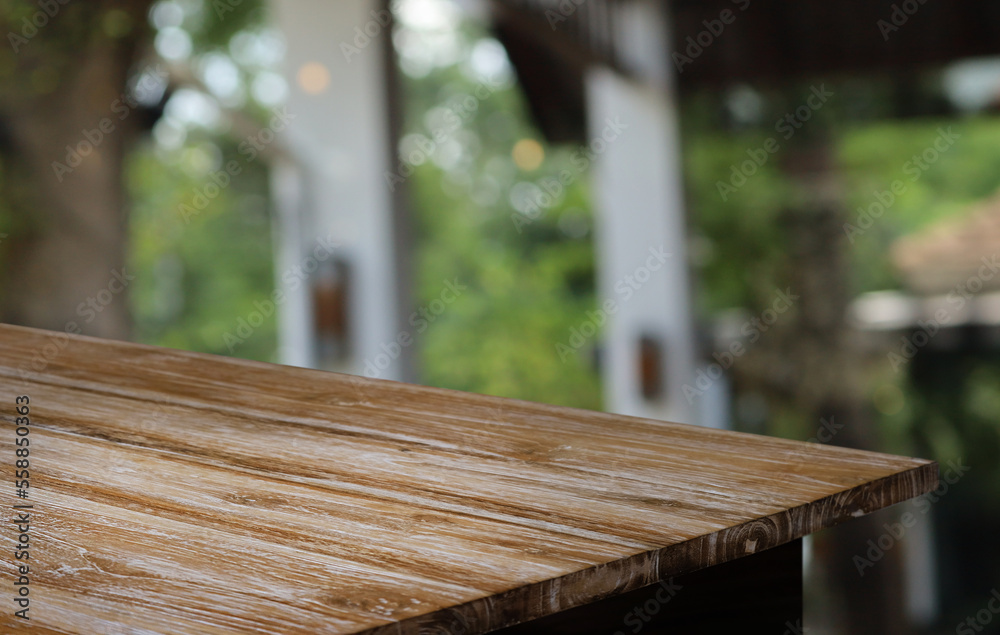 Empty wooden table in front of abstract blurred background of coffee shop . can be used for display or montage your products.Mock up for display of product Empty wooden table in front of abstract blurred background of coffee shop . can be used for display or montage your products.Mock up for display of product