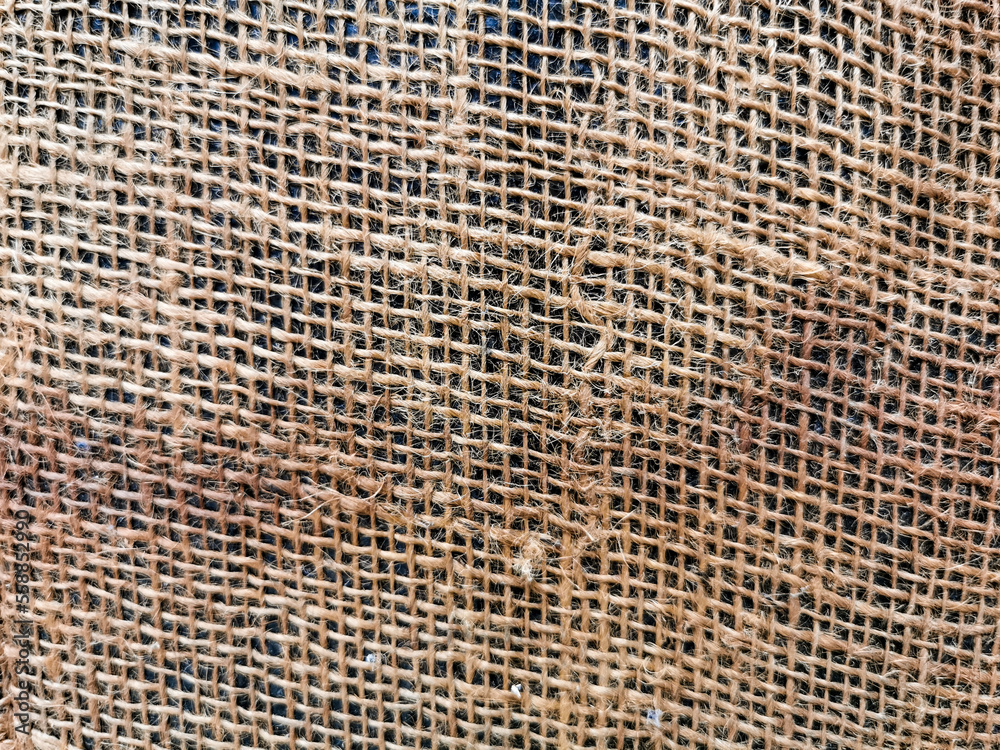 Selective focus close up image with noise effect brown crumpled burlap texture for background purpose. Selective focus close up image with noise effect brown crumpled burlap texture for background purpose.