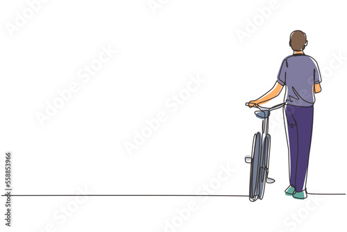 Continuous one line drawing walking young male with bicycles. Happy man take a walk with bicycle at city road. Healthy lifestyle of urban people. Single line draw design vector graphic illustration