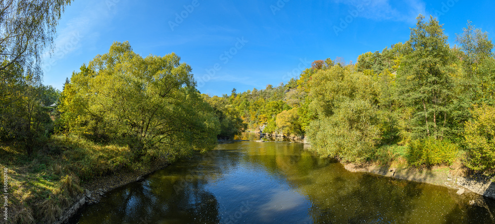 river in valley surrounded with forest