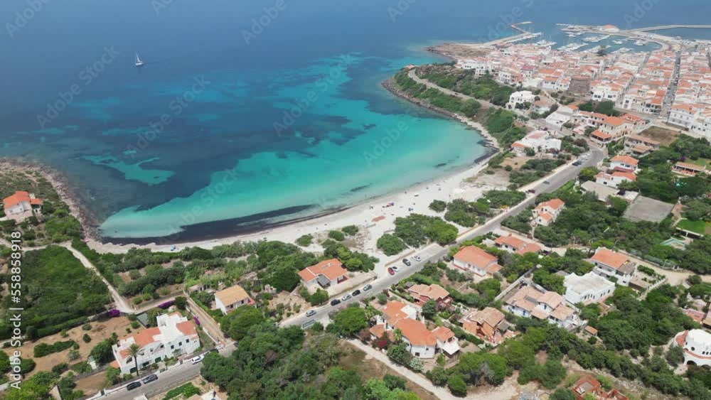 Sotto Torre Beach at Calasetta Beach Town, Sardinia, Italy - 4k Aerial Panning Down Sotto Torre Beach at Calasetta Beach Town, Sardinia, Italy - 4k Aerial Panning Down