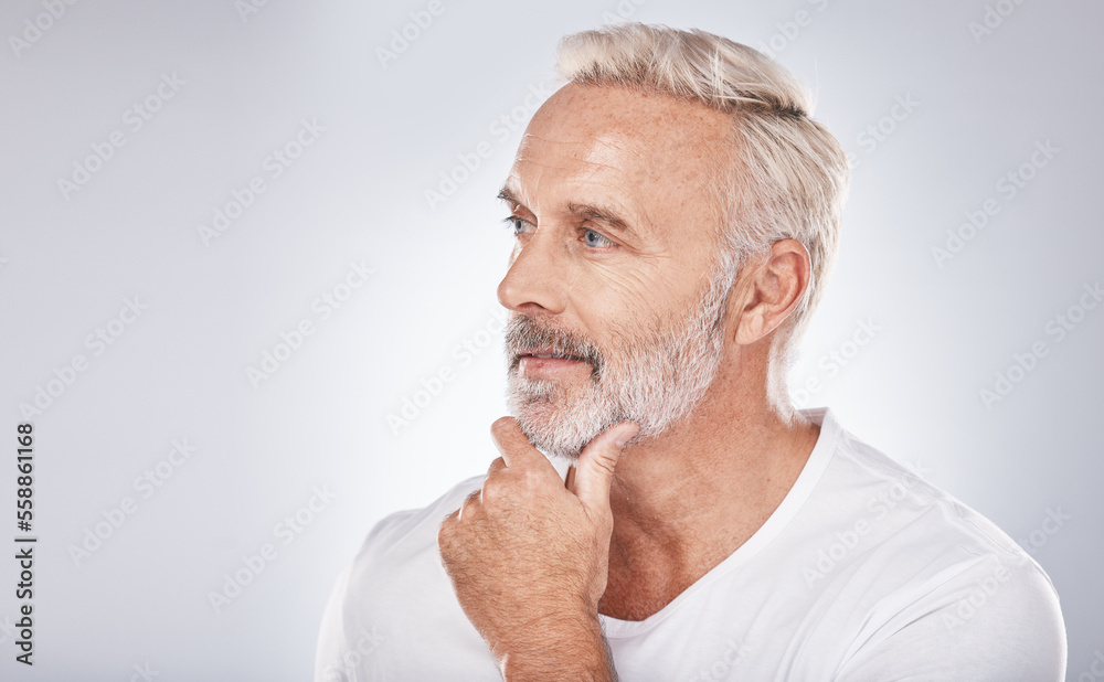 Face, thinking and senior man in studio isolated on a gray background mock up. Skincare, cosmetics and retired elderly male lost in thoughts or contemplating ideas for beauty, grooming and wellness.