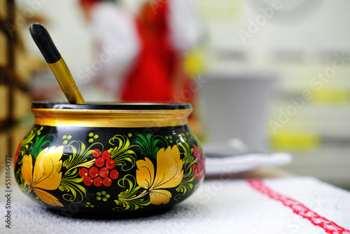 фотографія Russian folk Khokhloma dishes on the napkin with Slavic pattern.