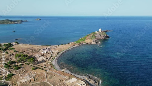 Nora Peninsula and Archeological site with Roman ruins in Sardinia, Italy - Aerial backwards photo