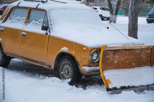 Passenger car has been converted into snowplow.