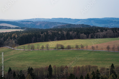 A romantic view of the beautiful valleys and arable fields from the Stołowe Mountains, a distant view to the horizon, a large space that gives a sense of freedom and independence. Polish Karkonosze, b