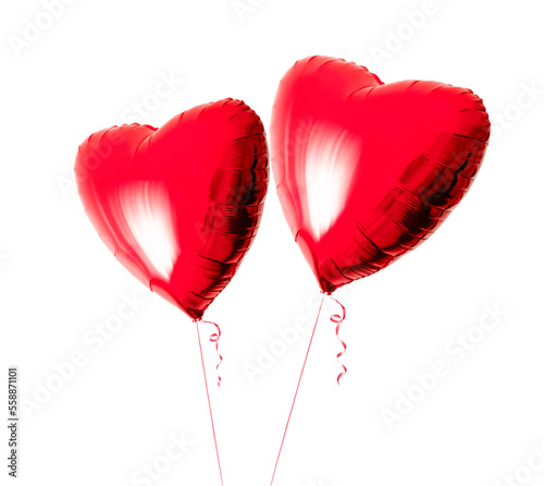 Two beautiful big red heart shaped balloons with ribbon isolated on a white background. Valentines day. Love symbol. Beautiful birthday party gift. Floating objects. Inflatable ball by helium gas.