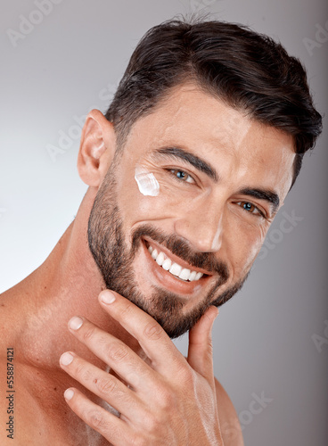Man, face and cream for skincare and beauty closeup with sunscreen, facial portrait and moisturizer. Lotion, skin wellness and glow with happy model, cosmetic care mockup against studio background