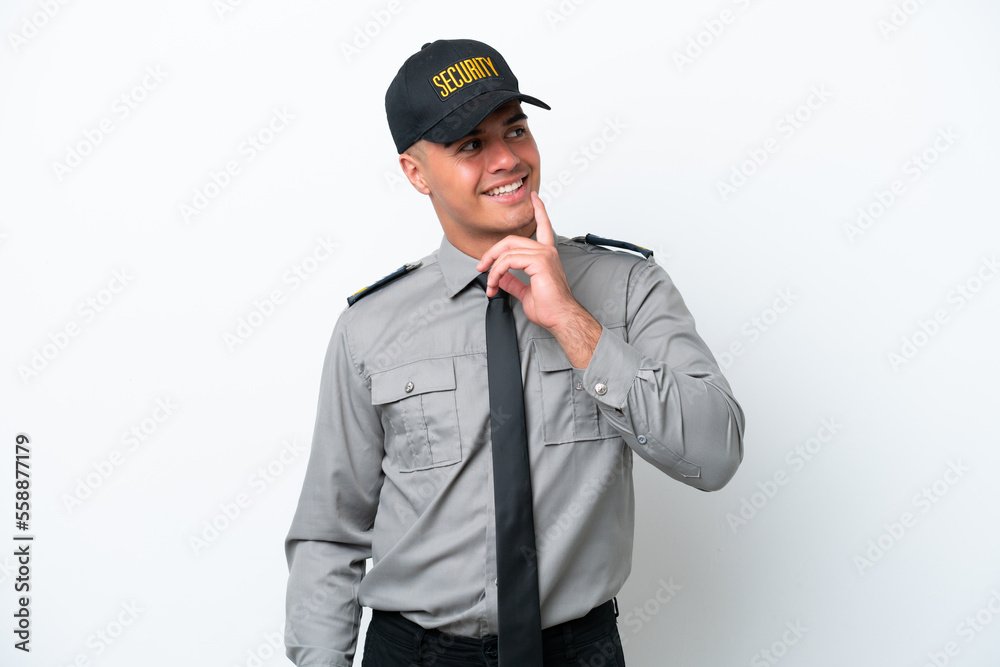 Young caucasian security man isolated on white background thinking an idea while looking up Young caucasian security man isolated on white background thinking an idea while looking up