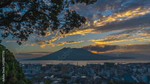 Time lapse of sunrise behind active Sakurajima volcano, Kagoshima cityscape view