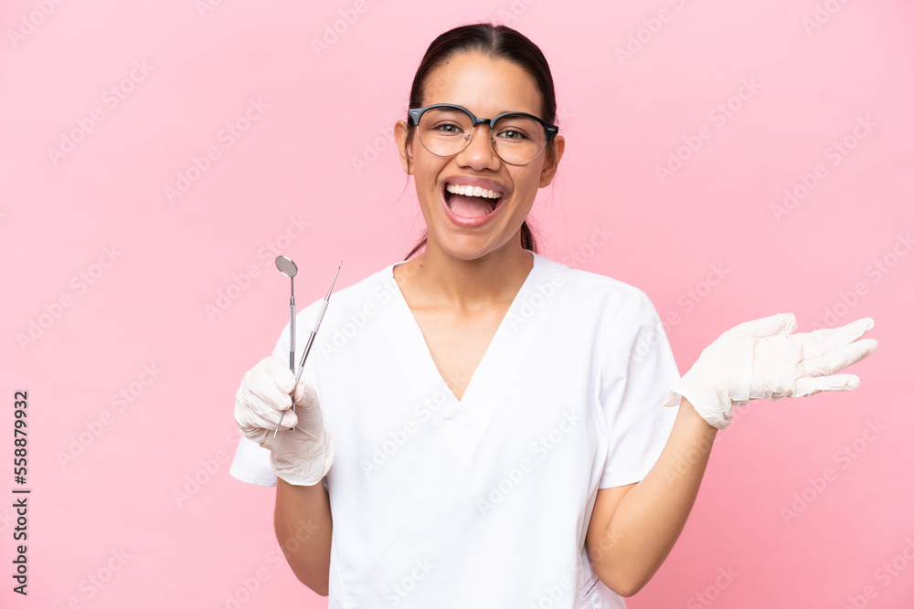 Dentist Colombian woman isolated on pink background with shocked facial expression Dentist Colombian woman isolated on pink background with shocked facial expression