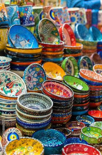 Stack of classical traditional Turkish ceramics, handmade colorful dishes at the Istanbul Egypt Bazaar (Misir Carsisi). Istanbul, Turkey souvenirs. Selected focus, copy space © Elena