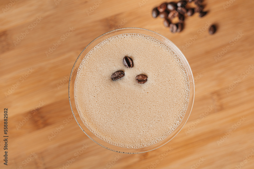 Espresso Martini cocktail garnished with coffee beans, top view Espresso Martini cocktail garnished with coffee beans, top view