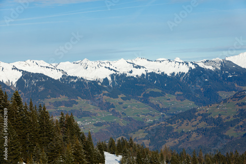 View of a mountain valley with snowy mountains. Brandnertal, Austria
