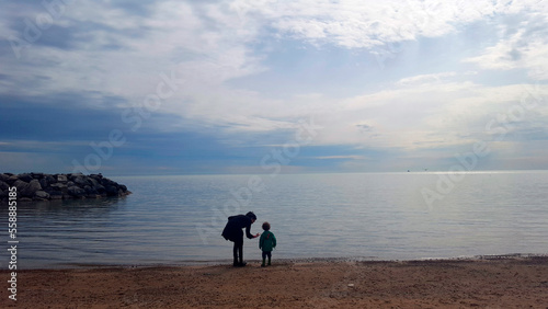 Mother and son on shore of Lake Michigan, Chicago, Illinois, USA photo