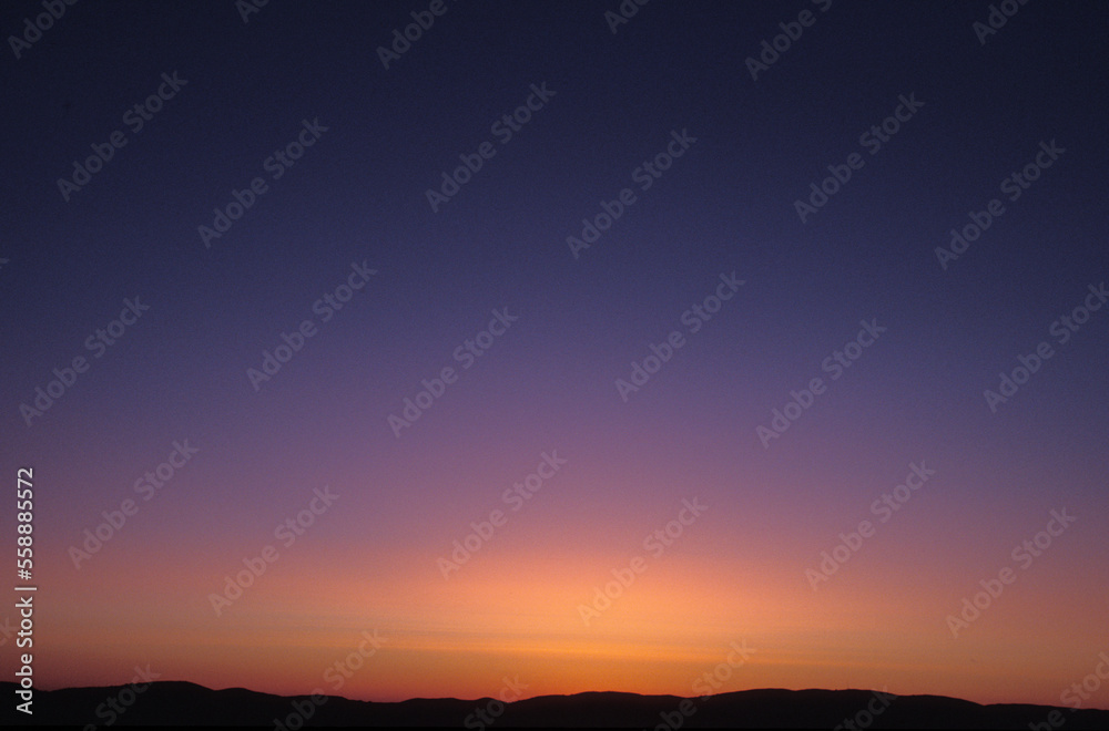 A calming purple and orange sunset over Antelope Valley, California. A calming purple and orange sunset over Antelope Valley, California.