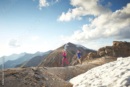 ultra runner, Ben Clark and women trail run in the San Juan Mountains high above Telluride Colorado photo