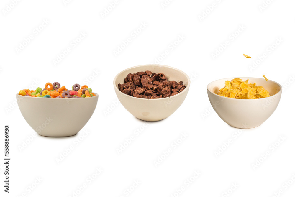 Corn flakes falling to the white bowl. Motion. Corn flakes falling to the white bowl. Motion.