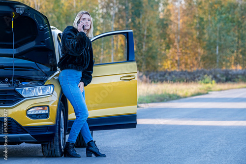 A woman waiting for roadside assistance. photo