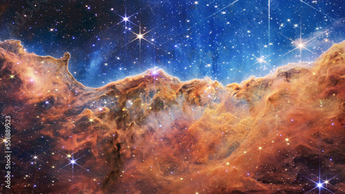Cosmic Cliffs in the Carina Nebula. James Webb Space Telescope. Glittering Landscape of Star Birth. Elements of this image furnished by NASA. photo
