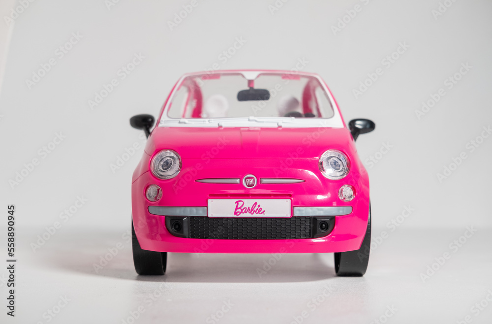Kent, uk, 01.01.2023, A Barbie Pink Fiat 500 Car Sports Toy Vehicle  isolated on a white background. Modern barbie plastic fantastic pink doll  car. Famous doll toys for boys and girls. Stock